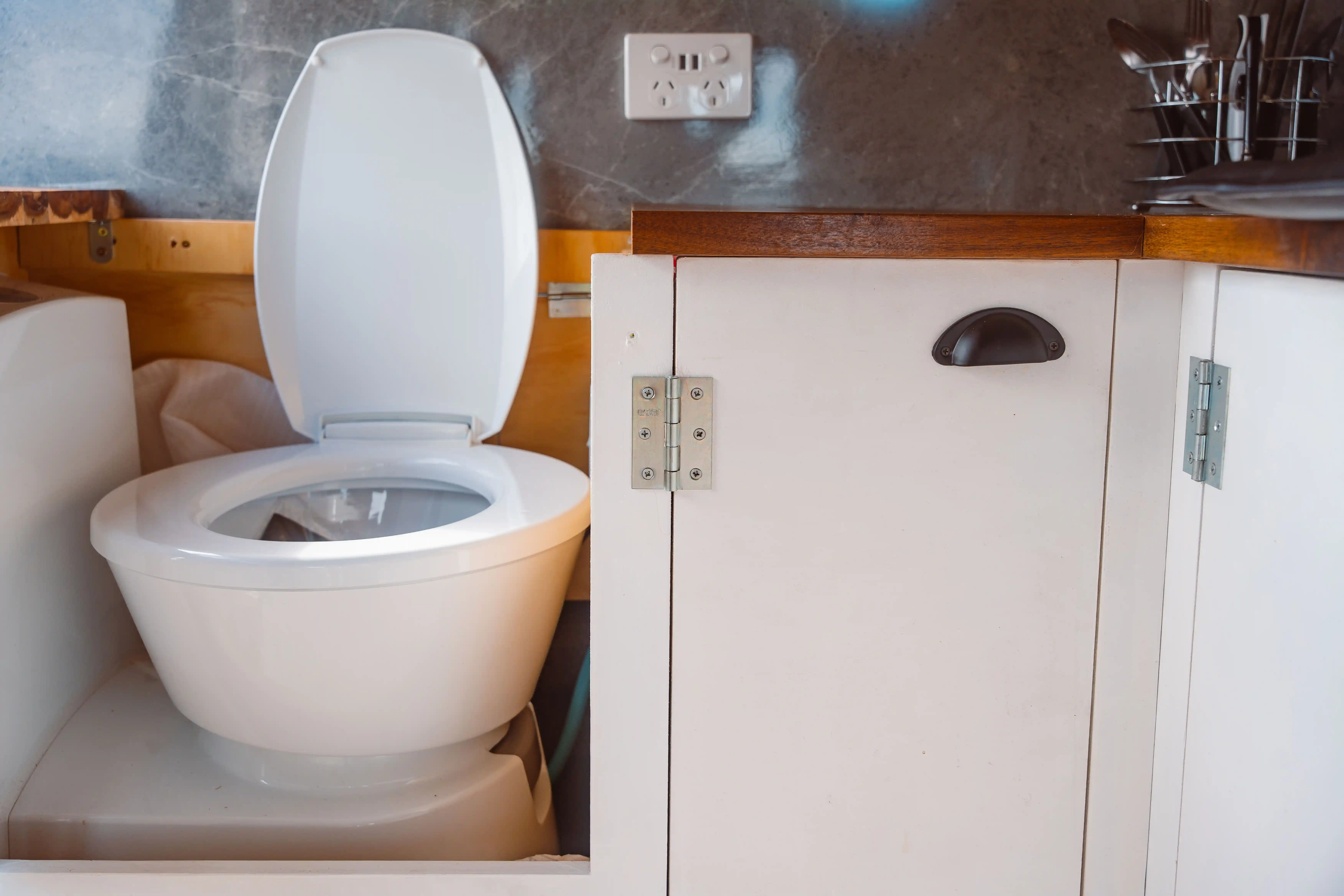 Fixed toilet inside a self contained campervan in New Zealand