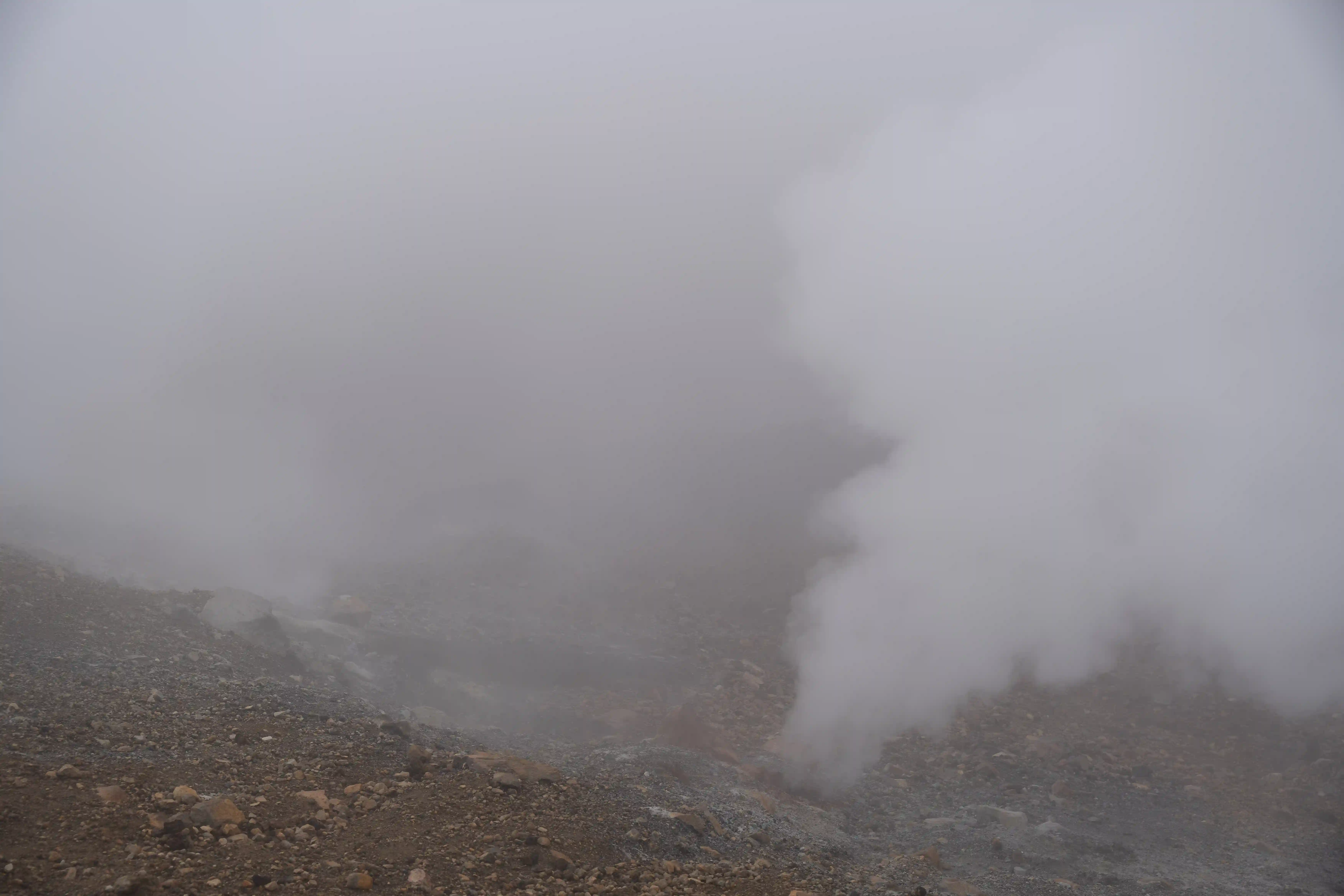 Hot vents pumping steam into the air from deep underground