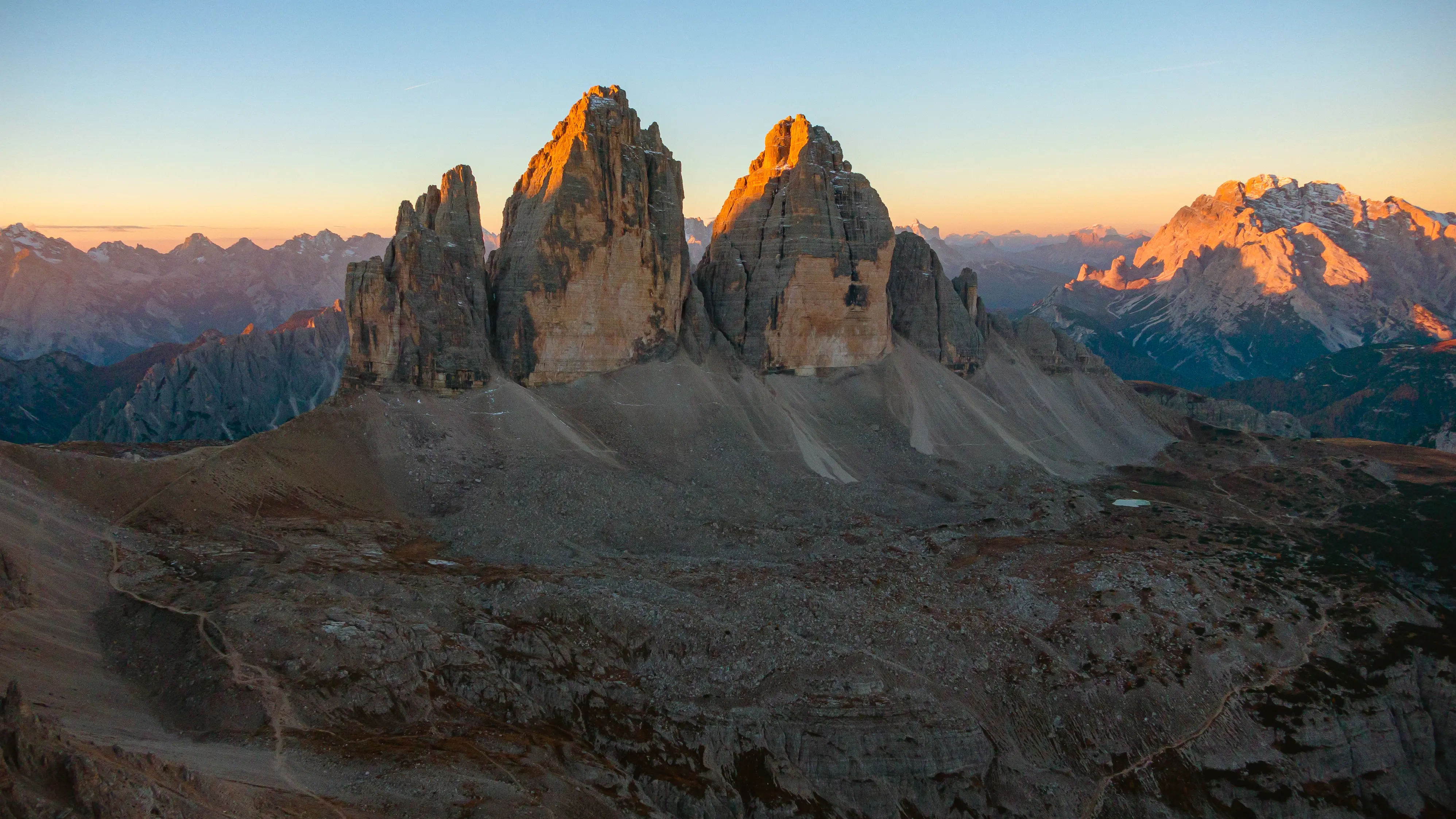 Pre-dawn alpenglow on Tre Cime di Lavaredo in the Italian Dolomites